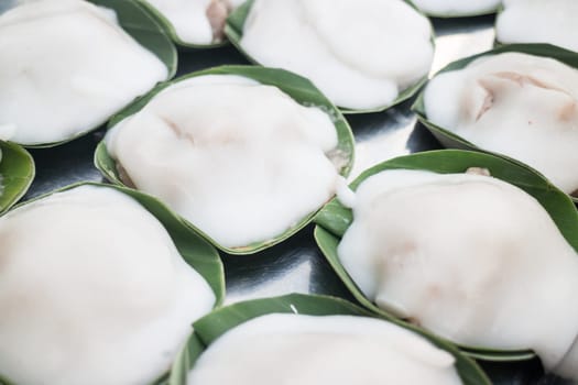Thai dessert sweet coconut milk on banana leaf, stock photo
