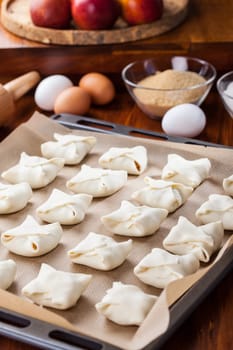 Delicious apple turnovers with baking ingredients