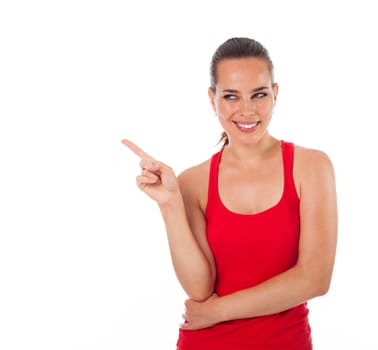 Young smiling woman showing something with her finger, copyspace, isolated on white