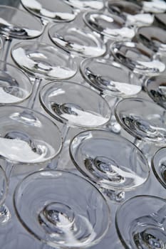 A heap of glasses on a table of a restaurant