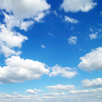 Blue sky background with tiny clouds