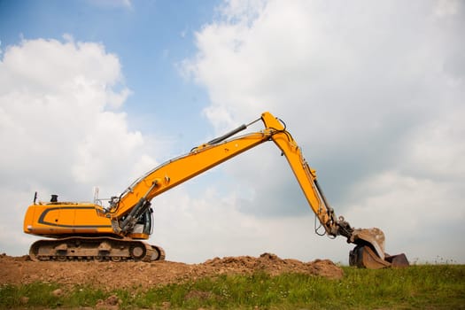 Excavator building a dike in the Netherlands.