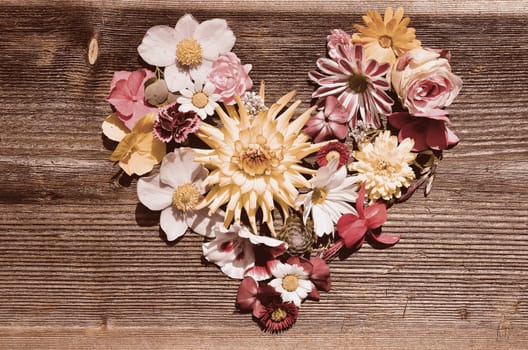 Flower heart on wood
