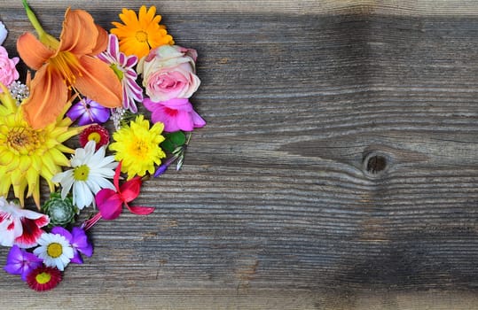 Flower heart on wood