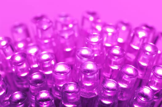 Macrodetail of some pink LEDs in pink light