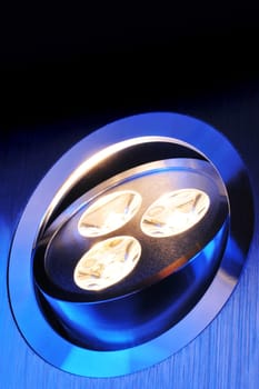 Macrodetail of a warm white triple LED in blue light