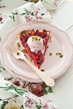 Cake with fresh plums with a scoop of ice cream