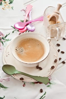 Vintage cup with coffee and brown sugar