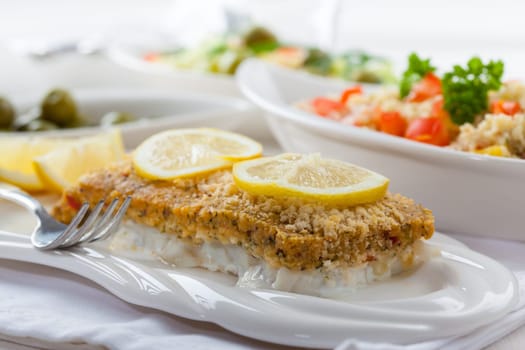 Baked fish fillet wih fresh couscous salad