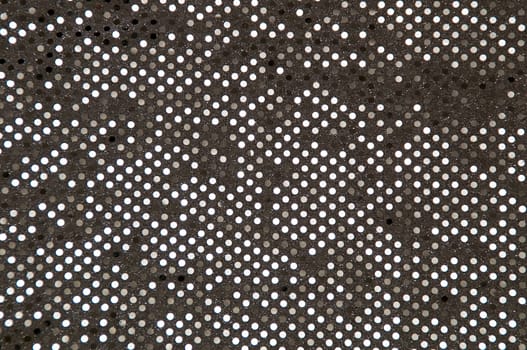 Abstract image of a silver grey sequined piece of fabric typically used to make dancer's costumes or dresses.