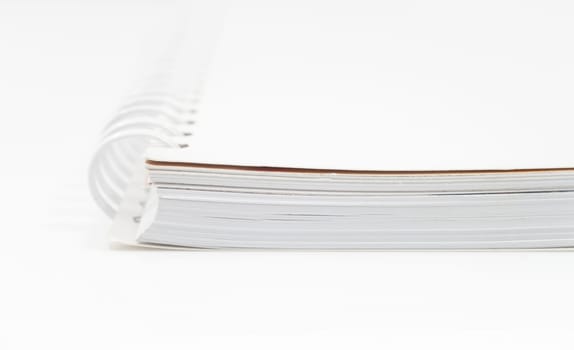 Closeup spiral notepad isolated on white background, stock photo