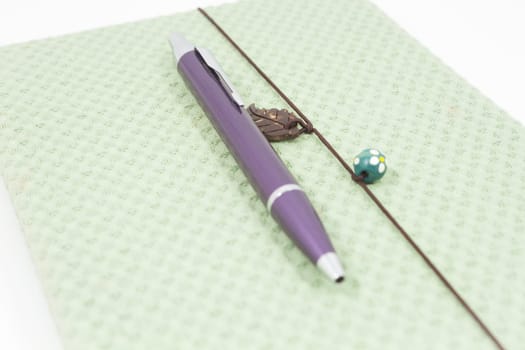 Handmade notebook with pen isolated on white background, stock photo