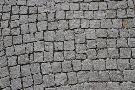 Close up on granite cobblestoned pavement background