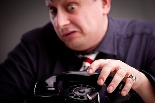 Telephone rings and the clerk is afraid of taking the call