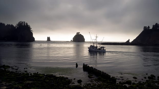 A fisherman heads out to work some more before sunset from the Marina in LaPush