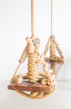 Vintage hanging swing seat on white background, stock photo