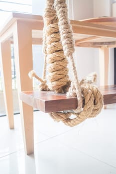 Vintage hanging swing seat in the cafe, stock photo