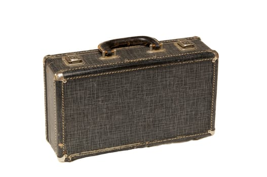 A small antique hard case with locks and handle shot over white.