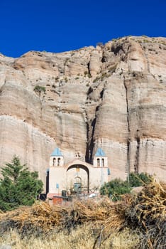 Church set against a dramatic cliff in the small town of Espicaya near Tupiza, Bolivia