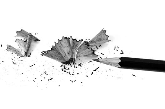 Sharpened pencil and shavings background. Black and white.