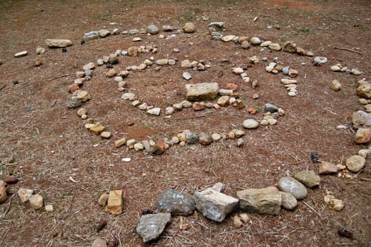 Spiral made of stones abstract geometric shape. Nature background.