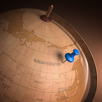 Antique globe with the Russia marked by the pin. Clipping path included.