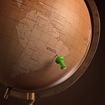 Antique globe with the Brazil marked by the pin. Clipping path included.