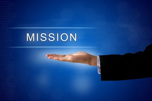 mission button with business hand on a touch screen interface