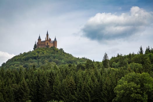 Hohenzollern Castle in Germany on a Forested Mountain.