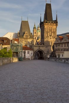 Charles Bridge and Mala Strana Tower in the early morning (Prague, Czech Republic). Vertically.