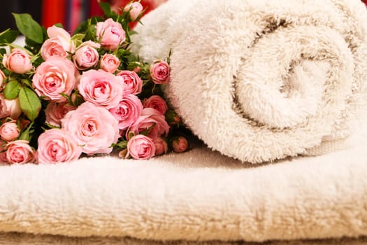 Bunch of small pink Roses on towels, close up..