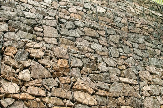 Gabion plastic covered wire mesh baskets filled with stone for slope stabilization