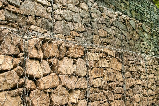 Gabion plastic covered wire mesh baskets filled with stone for slope stabilization