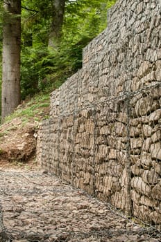 Gabion plastic covered wire mesh baskets filled with stone for slope stabilization