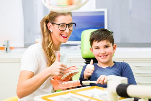 Dentist treats patient in dental practice