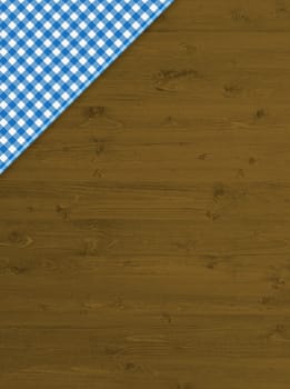 Brown wooden background with blue and white tablecloth in the corner