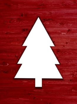 Christmas tree on red wooden boards