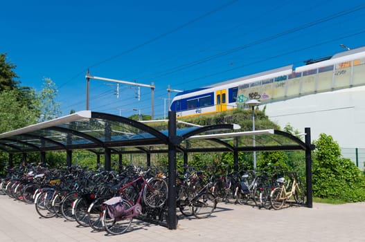 covered bicycle parking at a train station in the netherlands