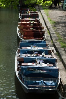 Three Spreewald barges moored on the shore near Lübbenau