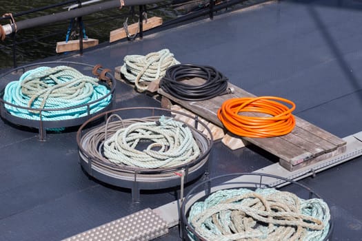 An orderly collection of cables,hoses and ropes
