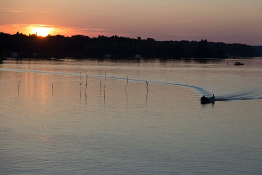 Small motorboat before sunset at the Jungfernsee