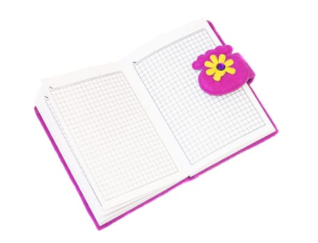 Open notebook in a purple cover on a white background