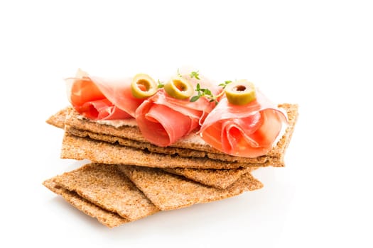 Finnish rye crispbread with salami Milano,Coppa ham,Prosciutto Crudo,Emmentaler,cream cheese with Herbs of Provence and Olive