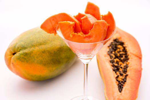 Fruit pulp of the papaya assorted in a cocktail glass. The papaya is a popular breakfast fruit..