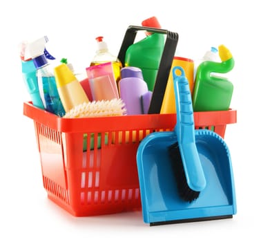 Shopping basket with detergent bottles and chemical cleaning supplies isolated on white