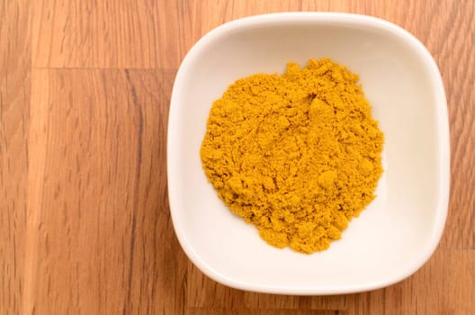 Curry powder in a white ceramic bowl