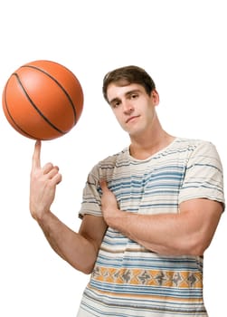 Torso view of a young man in a striped T-shirt against a white background juggling a basketball juggling and looking cool into the camera