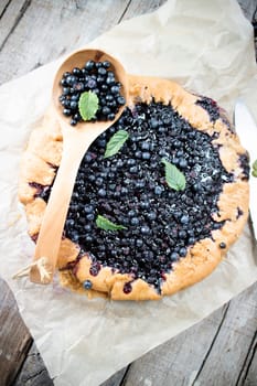 Photographic documentation of a rustic cake made with wild blueberries 