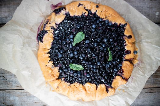 Photographic documentation of a rustic cake made with wild blueberries 