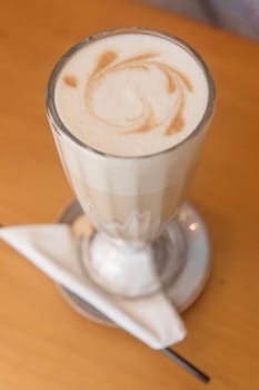 Latte in a glass glass, Breakfast in a cafe